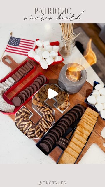 Tara Tedesco | Tnstyled | PATRIOTIC S’MORES BOARD! ❤️🤍💙  Comment “SMORES” and I’ll send you these cardboard USA letters! They are perfect for all... | Instagram Smores Bar Ideas, Flag Smores Dip, 4th Of July Smores, Smores Dip Recipe 4th Of July, S'more Platter, Indoor S’mores Charcuterie, S’mores Dip July 4th, Different Cookies, July Desserts