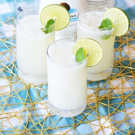 Coconut Mojito Recipe - Fun Money Mom Limeade Drinks, Resep Vegan, Brazilian Lemonade, Coconut Mojito, Fun Money, Mojito Recipe, Lemonade Recipes, Delicious Cocktails, Limes