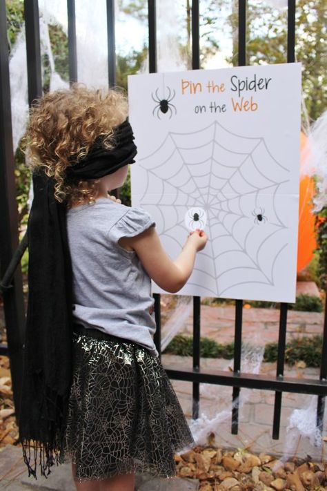 Pin the Spider on the Web Game | CatchMyparty.com Halloween Pin The Spider On The Web, Pin Spider On Web Game, Eyeball Toss Halloween Game, Prek Halloween Party Games, Toddler Halloween Games Activities, Spider Web Toss Game, Halloween Outside Activities For Kids, Pin The Halloween Game, Pin The Tail Halloween Game