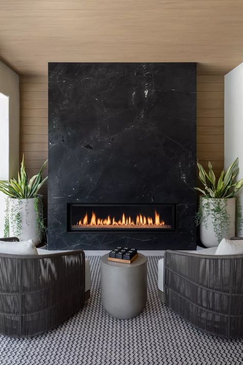 25 Outdoor Fireplace Ideas That Are Warm and Cozy Outdoor Tiled Fireplace, Linear Fireplace Tile Surround, Dekton Fireplace, Dark Fireplaces, Black Modern Fireplace, Modern Fireplace Tv Wall, Black Fireplaces, Black Marble Fireplace, Slate Fireplace Surround