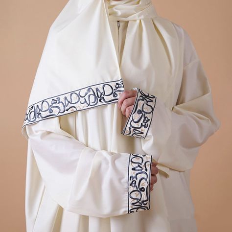 Arabic embroidered prayer dress and Carpet #Arabic #dress #Gift #Medina #prayer_dress #SilkDress #women #taswiquh Elevate your prayer experience with our exquisite Arabic embroidered prayer dress and carpet set. Crafted with intricate details, this set features a prayer rug with a mesmerizing design adorned with Arabic calligraphy letters, creating a serene and inspiring space for your prayers. https://taswiquh.com/product/arabic-embroidered-prayer-dress-and-carpet/ Arabic Calligraphy Letters, Prayer Dress, Arabic Dress, Simple Hand Embroidery Patterns, Arabic Calligraphy Art, Arab Fashion, Calligraphy Letters, Prayer Rug, A Prayer