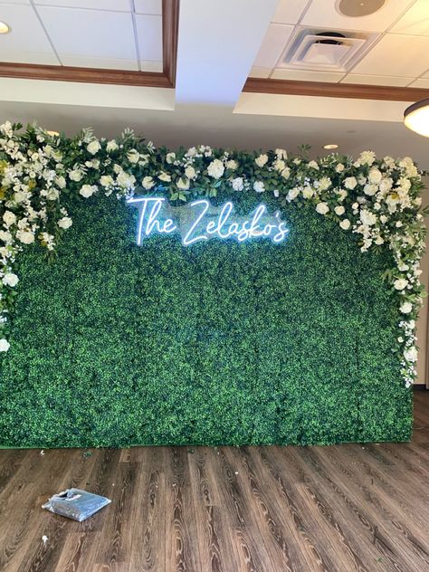 Hedge Wall Wedding Backdrops, Moss Flower Wall Photo Backdrops, Green Wedding Backdrop Receptions, Green Floral Background Flower Wall, Grass Wall Flowers, Faux Flower Backdrop, Flower Wall And Neon Sign, Green Turf Backdrop, Faux Grass Wall With Neon Sign