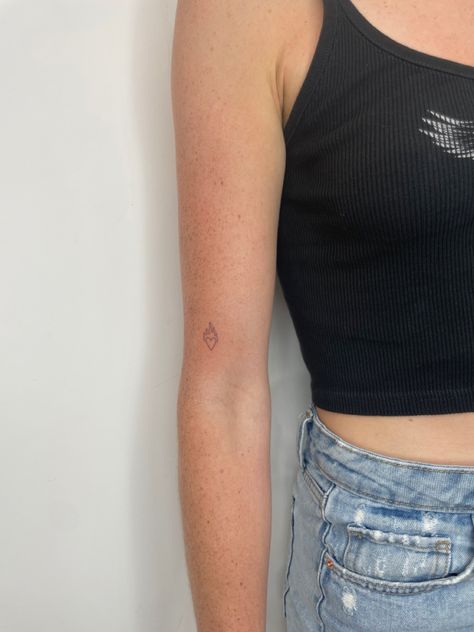 heart tattoo emoji tattoo single needle tattoo Aesthetic Heart Tattoo, Fire Emoji Tattoo, Tiny Heart On Fire Tattoo, Small Heart On Fire Tattoo, Tiny Fire Tattoo, Fire Heart Emoji Tattoo, Heart Tattoo Location, Heart And Flame Tattoo, Tiny Flame Tattoo