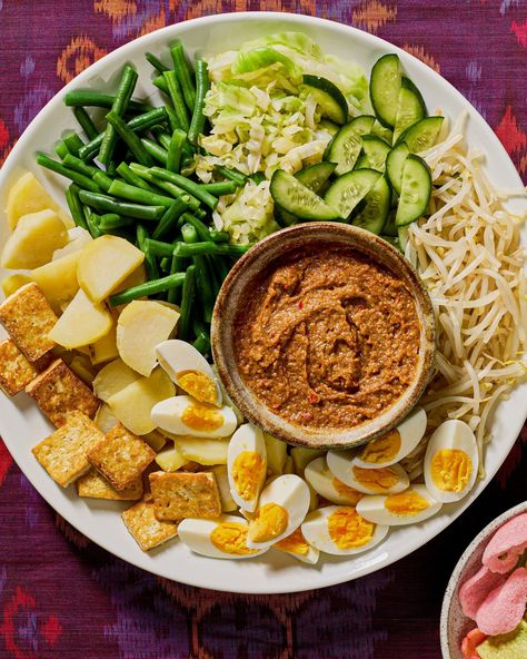 You gotta try gado gado. It's one of Indonesia's national dishes and is cherished by everyone. Gado gado is a delightful platter of cabbage, mung bean sprouts, green beans, potatoes, and cucumber, along with other accouterments, but really anything goes! Get @pickles.and.tea's tips for how to lay out this luscious spread at the link bio. 📸:@melati_citrawireja Green Beans Potatoes, Beans Potatoes, Serious Eats Recipes, Gado Gado, National Dish, Mung Bean, Serious Eats, Bean Sprouts, Anything Goes