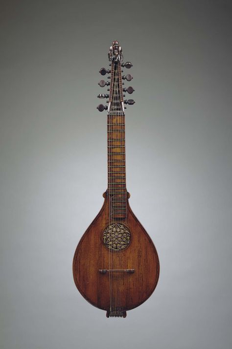 English cittern, circa 1600. A stringed instrument dating from the Renaissance, descended from the Medieval citole, or citole. Its flat-back design was simpler and cheaper to construct than the lute. It was also easier to play, smaller, less delicate and more portable. Played by all classes, the cittern was a premier instrument of casual music making much as is the guitar today. Cittern Instrument, Medieval Musical Instruments, Lute Design, Medieval Lute, Lute Instrument, Medieval Instruments, Old Musical Instruments, Instrument Design, Lucas Lima