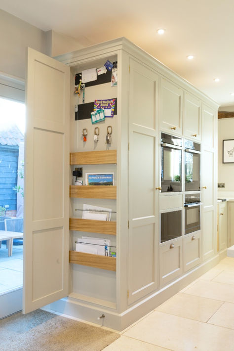 This hidden cupboard is perfect for storing the less aesthetic bits and bobs that you acquire but don't want to get rid of. We have disguised this in an end panel for easy access but keeping it concealed. Click for project details #BakerandBaker Decorative End Panels For Cabinets, Kitchen End Cabinet Ideas, Kitchen End Panel Ideas, Small Hidden Pantry, Hidden Kitchen Cabinets, Cool Kitchen Cabinet Ideas, Hidden Fridge Kitchen, Boiler Cupboard Ideas, Hidden Storage Kitchen