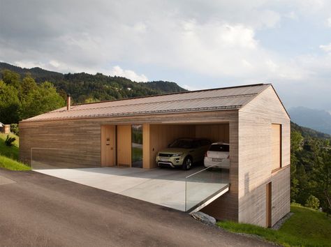 the dwelling is nestled into the steep hill with terraces on both floors looking out to the pristine landscape. Slope House Design, House On Slope, Slope House, Hillside House, Minimalist House Design, Timber House, Minimalist Architecture, Garage Design, Design Del Prodotto