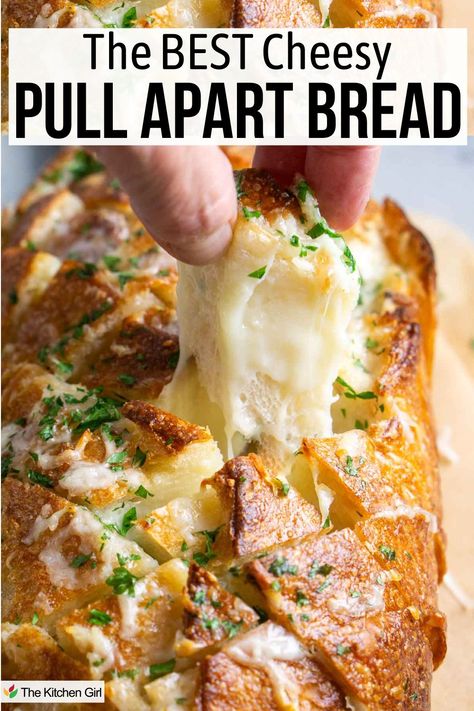 Person's hand pulls a cheesy bread square from the loaf with a stretchy cheese pull trailing under it. Title: The Best Cheesy Pull Apart Bread. Pull Apart Garlic Bread Pizza Dip, Cheesy Loaf Bread, Cheesy Garlic Pull Apart Sourdough Bread, Garlic Pull Apart Bread Bundt, Easy Bread Appetizers For A Party, Stuffed Pull Apart Bread Recipes, Appetizer Recipes Bread, Savory Quick Breads Recipes, Pull Apart Bread Recipes Easy