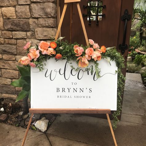 Floral welcome sign, greens and bright flowers, peach orange, green garland, bridal shower sign, floral signage, San Diego florist, bridal shower details, wedding details, wedding welcome sign, Watersigne Floral Bridal Shower Sign Flowers, Bridal Shower Sign With Flowers, Bridal Shower Peach Theme, Coral Bridal Shower Ideas, Peach Bridal Shower Ideas, Orange Welcome Sign, Welcome Sign With Flowers, Floral Signage, Cutie Theme