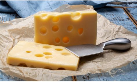 Two blocks of French emmental semi-hard cheese close up Easy Swaps, Comte Cheese, Emmental Cheese, Jarlsberg, Queso Manchego, Gourmet Cheese, Italian Cheese, Types Of Cheese, Gruyere Cheese