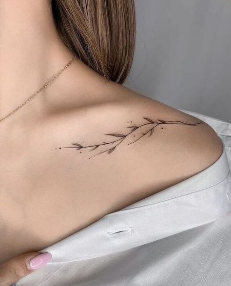 30 Gorgeous Shoulder Tattoos To Inspire Your Next Ink - 200😁 Inked Melodies: Sound Wave Tattoo Concepts  #tattooinspiration #inkedlife #bodyartlove #tattooaddict #tattooideas Minimalist Strength Tattoo, Shoulder Tattoos For Women Minimalist, Shoulder Wave Tattoo, Miniature Tattoos For Women, Tattoos Shoulder Women, Floral Collarbone Tattoo, Small Upper Arm Tattoos For Women, Shoulder Tattoos For Women Elegant, Shoulder Neck Tattoo