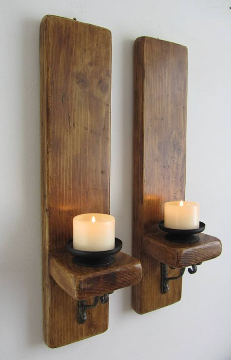 Pair of rustic wall sconces with removable black metal candle holders. Made from reclaimed 32mm thick planks with decorative cast iron brackets. Finished in antique brown beeswax. Suitable for holding candles up to 3 inches thick (not supplied). Available in various lengths , please Plank Wood Wall, Cast Iron Brackets, Rustic Wall Lighting, Shop Space, Iron Brackets, Rustic Wall Sconces, Plank Walls, Diy Candle Holders, Rustic Candles