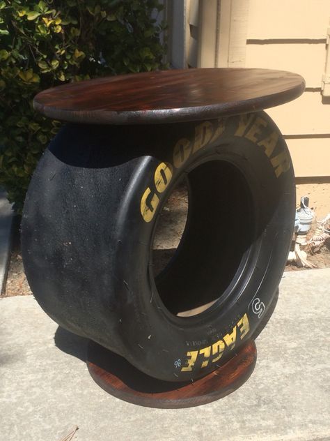 NASCAR tire from Sonoma Race turned into a side table. Nascar Tire Table, Nascar Tire Ideas, Nascar Room, Tire Diy, Kursi Ban, Tires Ideas, Racing Decor, Tire Table, Diy Industrial Furniture