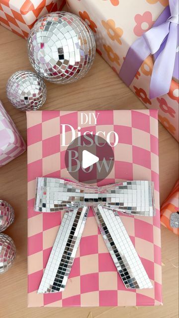 Stephanie Hanna on Instagram: "DIY Disco Bows 🎀🪩 The skies the limit with these! Start with wired ribbon, stick the disco tiles onto the ribbon, then use a glue gun to attach it. Can’t wait to celebrate Maven tomorrow. 🎉 My baby is getting so big! Inspo: @kailochic  . . . . . #giftidea #giftwrapping #giftwrappingideas #giftwrappingskills #giftinspo #giftwrapinspo #discoball #discobow #discoballdecor #diygiftwrap" Disco Tiles Diy, Disco Tiles, Disco Theme, Cowgirl Gifts, Birthday Inspo, Diy Tile, Gift Inspo, Diy Gift Wrapping, Bow Making