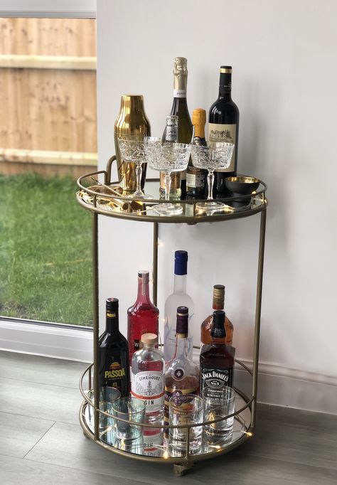 Drinks Trolley Aesthetic, Drinks Trolley Living Room, Cocktail Trolley Ideas, Home Bar Trolley Ideas, Alcohol Stand Home, Drink Trolley Styling, Alcohol Tray Bar Carts, Drinks Trolley Styling Living Room, Alcohol Trolley Bar Ideas