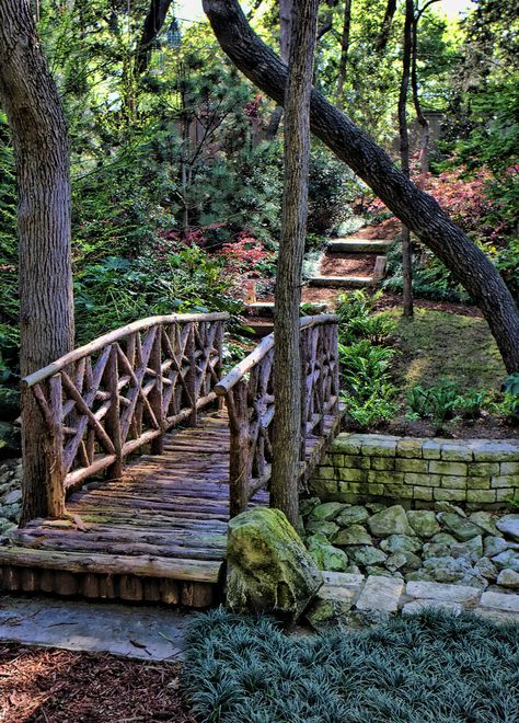 Fence Over Creek, Dry Creek Bed With Bridge, Log Bridge Over Creek, Walking Bridge Over Creek, Creek Landscaping Natural, Creek Bridge Ideas, Rustic Outdoor Structures, Garden Bridge Ideas, Bridge Over Pond