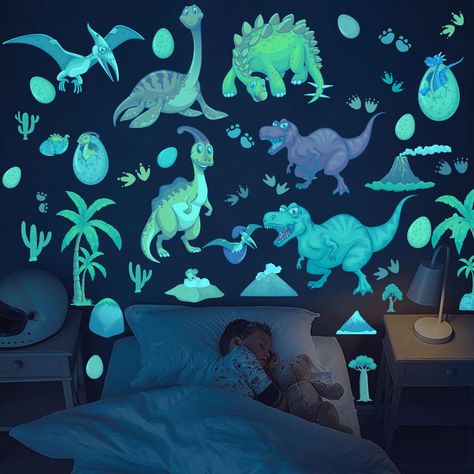 PRICES MAY VARY. GLOW DINOSAUR WALL DECALS:You will get 3 piece of luminous dinosaur wall decals in a set, including 3 assorted dinosaur super bright luminous wall stickers to turn your kid's room into a realistic dinosaur world. And soothe your child to sleep. LONG-LASTING GLOW: Just put it in the light or sunlight for 30 minutes before use the dinosaur wall stickers . It glows in the dark for 8-15 hours. The longer it absorbs light, the longer it will stay with you at night. HIGH QUALITY:The g Dinosaur Theme Playroom, Glow In The Dark Dinosaur, Dinosaur Kids Room Boy Bedrooms, Dinosaur Boys Room Ideas, Dinosaur Bedroom Ideas For Boys, Dino Boys Room, Dinosaur Themed Toddler Room, Dino Bedroom Ideas For Boys, Dino Kids Room