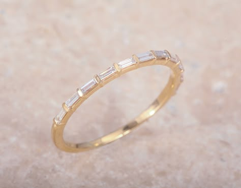 1/5 ct Diamond Baguette eternity band. Band measures approx. 1.15mm wide and is not customizable. We are only able to offer this band in sizes 6-8. Diamonds are GHI SI2-SI3.    Please note this ring takes 3-5 weeks to ship. Eternity Band Stack, Engagement Ring Cut, Baguette Eternity Band, Wedding Stack, Baguette Wedding Band, Baguette Band, Diamond Baguette, Future Engagement Rings, Ring Inspo