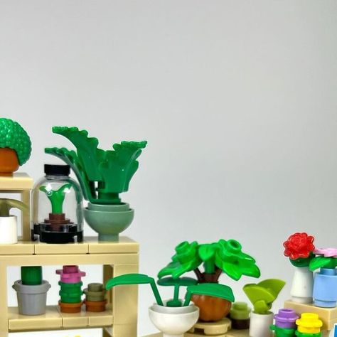 Jesse on Instagram: "Plant Shop 🌱 Here are most of the interior builds for my upcoming plant store 🪴 Including a wide range of merchandise like a terrarium, chia pet, succulents, venus flytrap, cacti, terracotta pots, and more! Which is your favorite? 🌵🌿🌼 . . . . #lego #afol #plant #plantshop #legomoc #legomodular #modular #plantlover #legocity #legotown #plants #legostore #venusflytrap #chia #terrarium #legoshop #legohouse #minifig #farmersmarket #legocreator #legofurniture #legobuilding #seeds" Chia Terrarium, Lego Terrarium, Lego Botanical, Lego Plants, Mini Creations, Lego Diy Crafts, Lego Masters, Lego Techniques, Lego Mosaic