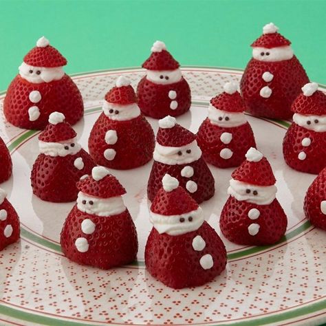 Mini Strawberry Santas | "You can easily make these little Santas as a holiday dessert yourself. All you need are strawberries, whipped cream, and some chocolate sprinkles. Your kids will love these yummy treats and can help put them together." Santa Recipes, Strawberry Santas, Snacks Sweet, Jul Mad, Christmas Dessert Table, Decorações Com Comidas, Christmas Fruit, Christmas Brunch, Xmas Food