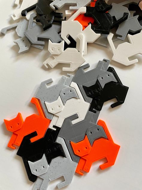 Tessellating Escher-style cat endless puzzle in a decorative storage box.  Perfect fidget toy for your desk or coffee table!  Includes storage box with sliding lid. Printed on demand with your choice of colors: two color box and 8 each of six colors of cats.   Box is 5.5 by 3.5 inches and just under 2 inches tall.  Cats are about 2.75 inches.  When checking out, choose your box colors and message us your color choices for the cat pieces.  Customers who do not message will receive cats in black, Notions Storage, 3d Tiskárna, Cozy Coffee Shop, Jackson Ms, 3d Printing Art, 3d Printer Designs, 3d Printing Diy, Cat Puzzle, Decorative Storage Boxes