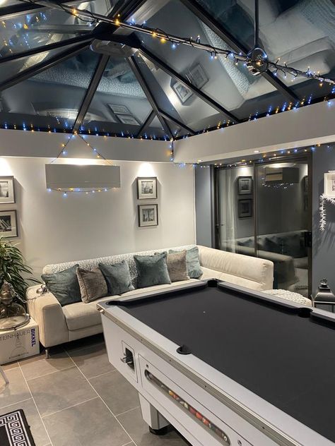 Pool table extensions are a great way to add value to your home. 5 Star designs and builds breathtaking orangeries and single storey pool table extensions that can be enjoyed by all the family. Lighting pelmets, skylights and sleek bi-fold doors help complete the winning look. #orangery #pooltable #homeinspo #fairylights #slidingdoors Pool Table Front Room Ideas, Garden Games Room And Bar, Black Conservatory Interiors, Conservatory Games Room, Game Room Sunroom, Home Pool Room, Outdoor Games Room, Orangery Extension Interiors, Games Room Bar