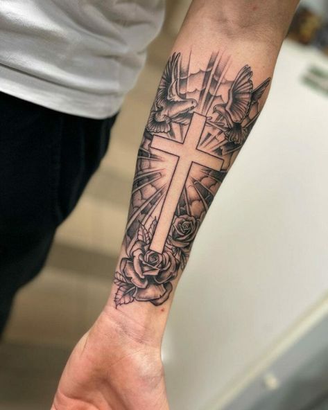 Cross tattoo photo Cross Arm Sleeve Tattoo, Cool Design Tattoos For Men, Cross With Background Tattoo, Cross With Lightning Tattoo, Tattoo Forearm Sleeve Men, Guy Sleeve Tattoos, Biblical Chest Tattoos For Men, For Arms Tattoo Men, Male Cross Tattoos