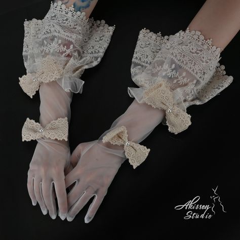 Embrace vintage elegance with our Victorian-Style Retro White Bridal Gloves. Crafted from smooth, high-quality fabric, these gloves feature beautiful ribbons that capture the timeless charm of the Victorian era. Perfect for brides seeking a touch of retro sophistication, these gloves add a graceful and romantic finishing touch to your bridal look. Length(fingertip to end): 47cm/18.5 inch Shipping takes 12-15 business days after order confirmation. Inventory: As this product is 100% handcrafted a 18th Century Gloves, Victorian Fashion Aesthetic, Soft Victorian Aesthetic, Victorian Gloves, Gloves Elegant, Hip Jewelry, Victorian Accessories, Elegant Gloves, Blue Strawberry