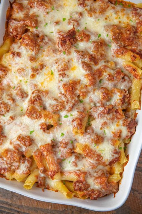 Ultimate Italian Baked Ziti creamy casserole with a homemade meat sauce, super EASY to make and super cheesy (three cheeses!) filling in under an hour. #bakedziti #ziti #cheese #cheesy #italian #italianrecipes #dinner #easyrecipes #dinnerthendessert Italian Baked Ziti, Classic Baked Ziti Recipe, Creamy Casserole, Homemade Meat Sauce, Dinner Recipes With Ground Beef, Easy Baked Ziti, Marinara Recipe, Dinner Then Dessert, Ziti Pasta