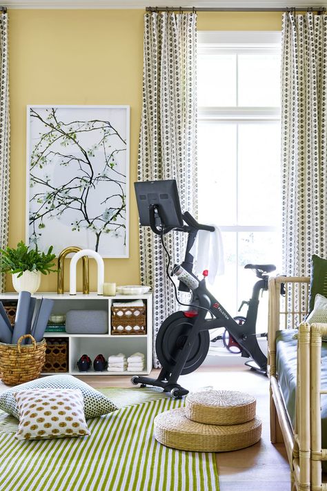 In a space typically reserved for a dining room, we created this workout studio and meditation pad—because when your gym is two seconds from the kitchen, you're more likely to put down the chips and roll out a yoga mat. A Peloton bike brings the trainer to you, and Ubarre weights double as sculpture. Meditation cushions await for when a 10-minute head-clearing is more vital than a good sweat, but in case you do perspire, the daybed seating is a resilient Moore & Giles leather.  Credits: rug, Lol Peloton Room Ideas, Peloton Room, Modern Home Gym, Bedroom Inspirations Minimalist, Workout Room Home, Gym Room At Home, Meditation Rooms, Dining Room Remodel, Home Gym Design