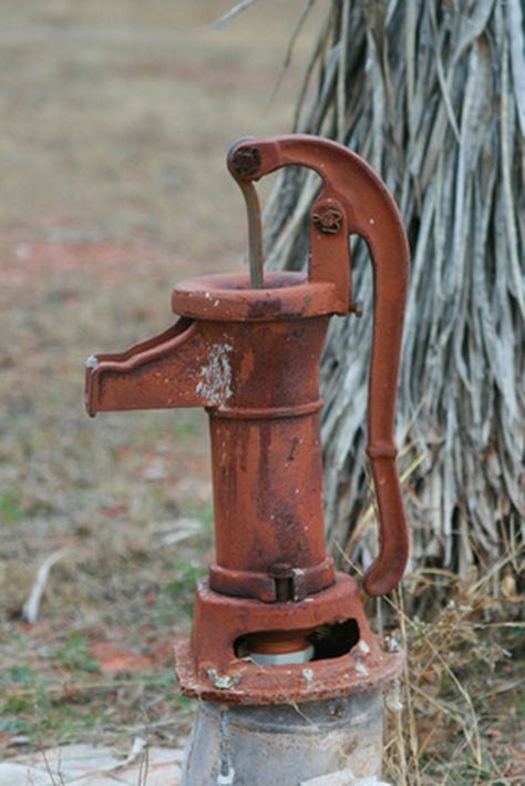 A cistern is a water storage tank buried in the ground, under houses or above ground. Older cisterns are usually made of materials such as cement, wood or metal. Outdoor, open-top cisterns capture rainwater while closed cisterns receive water from drains or pipes bringing water from other sources. Diy Water Pump, Hand Pump Well, Old Water Pumps, Hand Water Pump, Water Storage Tanks, Water Fountains Outdoor, Diy Water, Well Pump, Fountains Outdoor