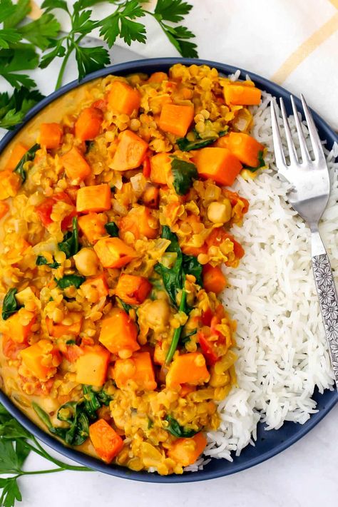 This butternut squash and chickpea curry is quick and easy to make, yet bursting with flavor and filled with healthy veggies and plant-based protein. Tender red lentils simmered with spices, tomatoes, spinach, chickpeas, and roasted butternut squash in a creamy coconut milk sauce! Butternut Squash Slow Cooker, Coconut Milk Sauce, Butternut Squash Stew, Butternut Squash Spinach, Savory Butternut Squash, Tomato Lentils, Butternut Squash Kale, Lentil Curry Recipes, Butternut Squash Curry