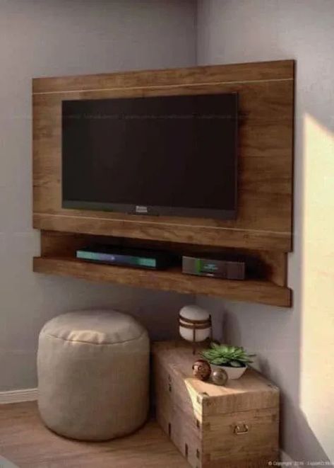 This corner wooden TV stand is suitable for small spaces or apartments.

#CreativeTVStands
#DIYMediaConsoles
#UniqueEntertainmentUnits
#InnovativeTVStandDesigns
#QuirkyHomeFurniture
#FunkyTVStandIdeas
#OutoftheBoxTVStands
#UnconventionalMediaStorage
#EccentricLivingRoomDecor
#OffbeatEntertainmentCenters Corner Tv Shelf, Diy Corner Tv Stand, Corner Tv Ideas, Tv Stand Inspiration, Portable Tv Stand, Unique Tv Stands, Tv Stand Ideas, Tv Placement, Wooden Tv Stand