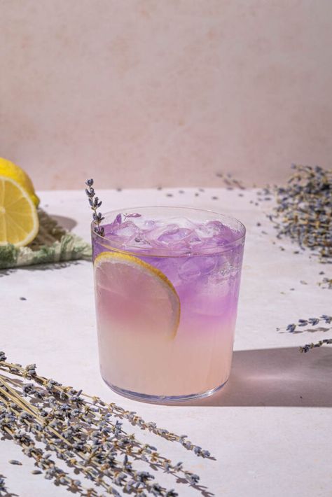 Purple Lavender Lemonade Recipe As the summer heat rises, it’s easy to crave something refreshing to cool down. There are countless beverages to choose from, but have you ever tried lavender lemonade? This delightful drink is both sweet and tangy, with a hint of floral notes from the lavender. If you’ve never made it before,... Read More The post Lavender Lemonade Recipe appeared first on The Boozy Ginger. Lavender Lemonade Recipe, Purple Lemonade, Lavender Drink, Unique Cocktail Recipes, Lavender Cocktail, Purple Drinks, Culinary Lavender, Lavender Syrup, Lavender Lemonade