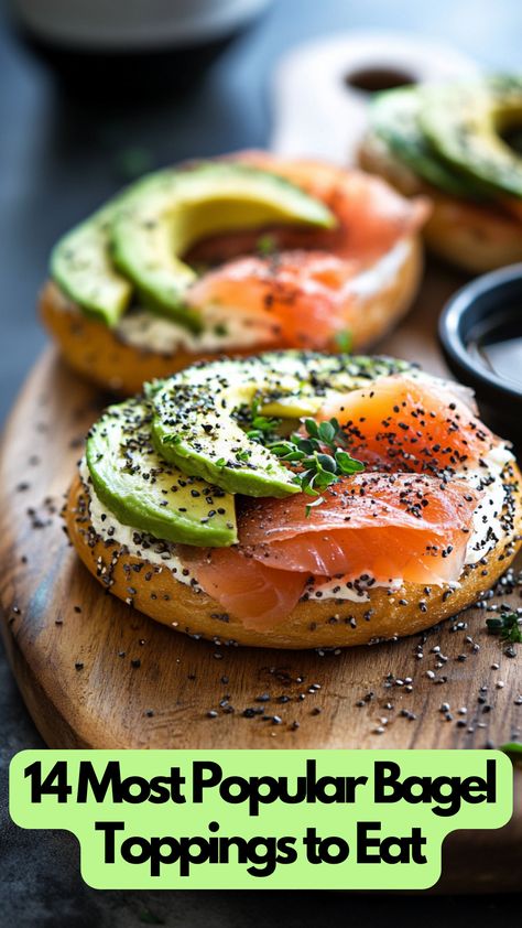 A toasted bagel topped with cream cheese, smoked salmon, avocado slices, and a sprinkle of herbs on a wooden board. Dairy Free Bagel Toppings, How To Eat Bagels, Bagel Bar Display, Sandwich Bagel Ideas, Bagel Cream Cheese Toppings, Bagels With Salmon And Cream Cheese, Build Your Own Bagel Bar, Salmon Avocado Bagel, Best Bagel Toppings