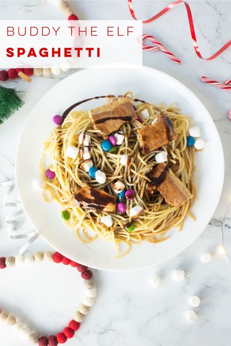 Buddy the Elf Spaghetti Recipe -- Sugar lover's rejoice! Learn to make the spaghetti our beloved Buddy the Elf makes in the Christmas movie Elf! Spaghetti topped with chocolate candies, marshmallows, chocolate syrup, maple syrup, and pop tarts! #buddytheelf #elfmovie #christmas #elfspaghetti #elfpasta | Mindful Avocado Elf Spaghetti Recipe, Buddy The Elf Spaghetti, Cookie Bars Christmas, Elf Spaghetti, Vegan Christmas Dinner, Avocado Vegan, Vegan Holiday Recipes, Vegan Christmas Recipes, Chocolate Candies