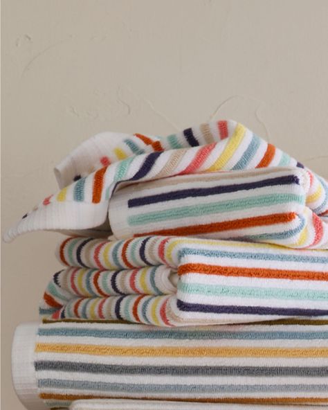 Refined stripes lend their playful edge to this absorbent bath towel of 100% long staple combed Aegean cotton. Ribbed 650-gram terry front and back. This product meets Standard 100 by OEKO-TEX. Striped dobby hem at both ends. Sides are finished with a clean white hem. Ribbed multi-stripe 650-gram cotton bath towels by Garnet Hill. Blue Bath, Striped Towels, Garnet Hill, Cotton Bath Towels, Mini House, Kids' Bathroom, Bath Towel, Bath Towels, Hand Towels