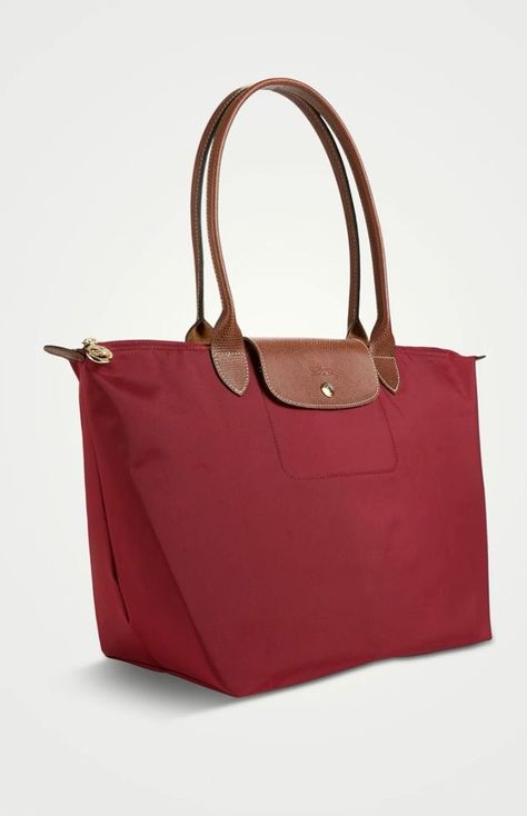 Longchamp Le Pliage large shoulder bag in red. Purchased: 2014, Holt Renfrew, Calgary, $180 CAD. Longchamp Le Pliage Outfit, Longchamp Red, Longchamp Le Pliage Large, Longchamp Bag, Holt Renfrew, Large Shoulder Bags, Longchamp Le Pliage, Winter Wardrobe, Calgary