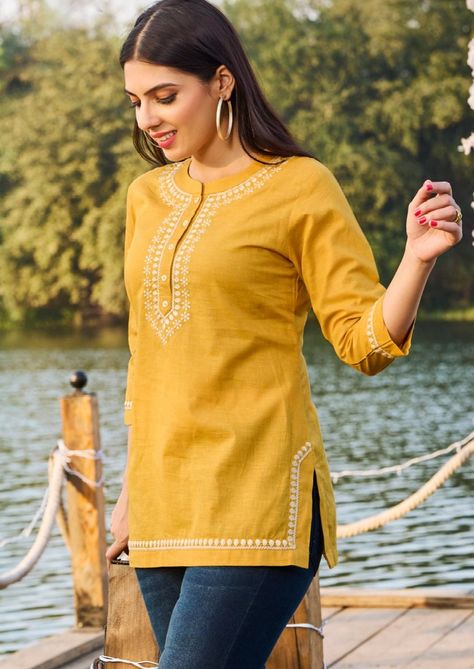 Tops and Tees/ Womens Short Kurtis/ Dresses For Women/Indian Wedding Dress/Pakistani Suit/ Kurta Palazzo Set / Kurtis for Women/ Gift for Women / T-shirt For women/ Summer Wear Product Details: Mustard Yellow Embroidery Cotton Tunic Mandarin Collar 3/4 sleeves Regular Wear Easy to carry In Summer Skin friendly Material and care: Cotton Hand wash Package Contents: Only one piece Kurta  PLEASE SEE THE SIZE CHART BEFORE PLACING THE ORDER WE ALSO ACCEPT CUSTOMISED ORDER AS PER CUSTOMER REQUESTS. For further details or any other queries please contact the shop owner Customer satisfaction is our first priority. Short Kurta Tops For Women, Yellow Shirts Women, Short Kurtas Women, Short Tunics For Women, Modern Tops For Women, Yellow Short Kurti, Short Kurti Designs Latest, Short Kurti Look, Short Kurta Designs Women