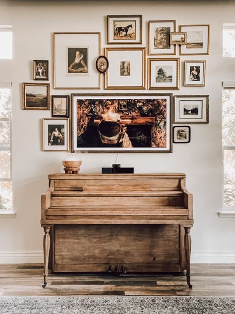 Gallery wall display with Samsung Frame TV Frame Tv Over Piano, Piano Gallery Wall, Gallery Wall Over Piano, Picture Frame Tv Gallery Wall, Gallery Wall Above Piano, Frame Tv Gallery Wall Living Room, Gallery Wall With Frame Tv, Tv Over Piano, Desk Gallery Wall