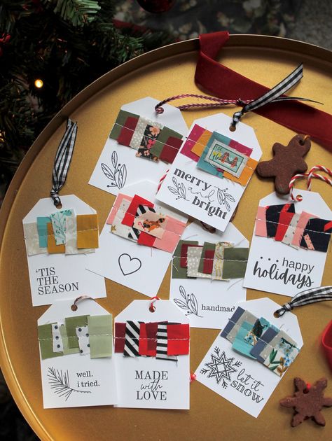 These print-and-sew tags are a phenomenal way to utilize small material scraps and spread holiday cheer. Simply print the page(s) with the tag designs that you would like to use on a medium-weight paper, chop up your fabric scraps as directed in the pattern, and sew them on for the perfect homemade tag. Pattern comes with fourteen various gift tag templates and an illustrated tutorial. Required tools to construct: Printer, paper(medium-weight is best), scissors, sewing machine, fabric scraps, an Fabric Christmas Tags, Ways To Use Scrapbook Paper, Fabric Gift Tags, Christmas Button Crafts, Homemade Gift Tags, Christmas Sewing Patterns, Homemade Tags, Tag Templates, Gift Tag Template