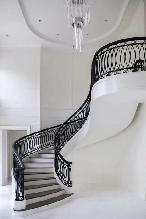 CRAFTED INTERIORS — Rock Ridge Round Stairs Design, Lojain Omran, Iron Staircase Railing, Round Stairs, Staircase Interior Design, Wrought Iron Stair Railing, Luxury Staircase, Iron Staircase, Iron Stair Railing