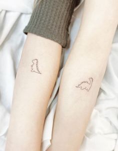 Tiny T-rex Tattoo, Tiny Dinosaur Tattoo, Cute Minimalist Tattoo, Minimalistic Tattoo Ideas, T Rex Tattoo, Dinosaur Tattoo, Minimalistic Tattoos, Matching Friend Tattoos, Minimalistic Tattoo