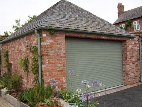 A charwell green electric roller shutter garage door on a modern detached garage. Windows Upvc, Garage Door Colors, Garage Door Paint, Electric Garage Doors, Roller Door, Painting Shutters, Green Shutters, Garage Remodel, Roller Shutters