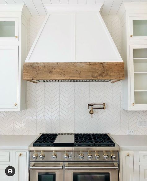 Kitchen Hoodfan Ideas, White Wooden Hoods Over Stove, Range Hood With Wood Beam, Wood Stove Hood White Cabinets, Wood Wrapped Kitchen Hood, Coastal Range Hood Ideas, Faux Kitchen Hood, White Kitchen Hood With Wood Trim, White Oak Oven Hood