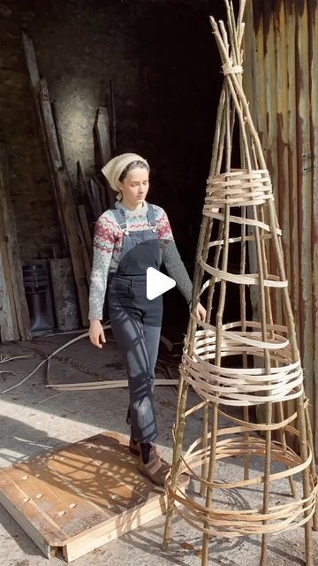 Charlotte on Instagram: "Every year I harvest hazel to build plant supports 🌳 This year I thought I’d try something different by weaving ash splints (the ones harvested in my last reel) through the poles, rather than working with more hazel.  This has given me a chance to get a feel for the ash before working on more intricate weaving projects. The splints were soaked before use to increase flexibility.   When the garden is still looking pretty bare, there is something really reassuring and uplifting about busying myself in preparation for what is to come. Harvesting canes and brush; building structures and supports; mulching pathways - all become creative acts in building form. Like preparing the future homes for the flowers and edibles that are just coming to life in the greenhouse 🌱🌼 Willow Garden Structures, Upcycle Garden Ideas, Become Creative, Garden Plant Supports, Willow Garden, Twig Art, Garden Poles, Willow Weaving, Upcycle Garden