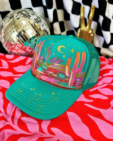 Over 30 new hand painted hats just went live! ��🔥 Florals fedoras marked $65 OFF and hand painted desert trucker hats!! Woohoo! 💖 these are sooooo cool and beautiful! I was listening to @radvxz while I made these because right now that’s all I can listen too! 😭 I’m kinda obsessed with her music! #truckerhat #truckerhats #hatbar #cowgirlstyle #cowgirlfashion Hand Painted Gift Ideas, Painted Trucker Hats, Hand Painted Hats, Textured Hat, Diy Hats, Craft Fair Booth Display, Custom Cowboy Hats, Hat Bar, Obsessed With Her