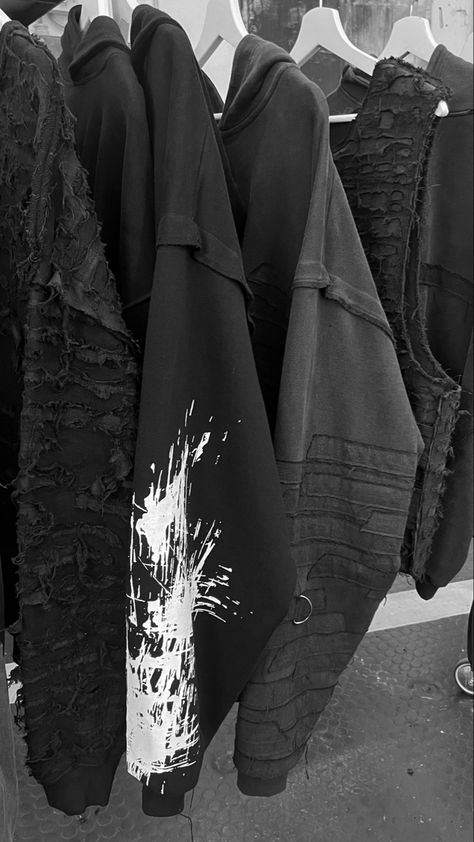 On display are newly created artworks in the form of clothes hanging on an industrial wardrobe. Hoodie Fits Aesthetic, Alternative Fashion Diy, Abstract Streetwear, Punk Tank Top, Distressed Fashion, Expensive Fashion, Charcoal Sweater, Camo Sweater, Edgy Aesthetic