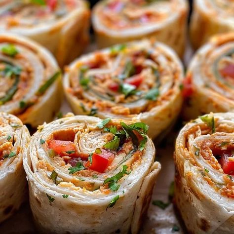 Learn to make Chicken Taco Mexican Pinwheels, a quick and tasty Tex-Mex appetizer. Perfect for parties and family gatherings! Mexican Pinwheels, Mexican Recipies, Puff Pastry Pinwheels, Taco Mexican, Chicken Pinwheels, Pinwheel Sandwiches, Tortilla Rolls, Southwest Chicken, Chicken Taco