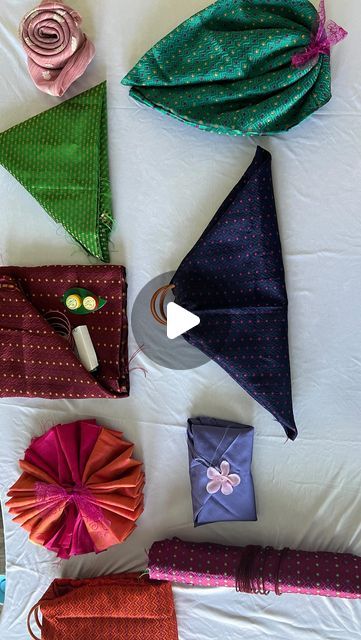 Shruthi Gowda😍 on Instagram: "Quick and easy blouse piece return gift wrapping ideas.

Make this upcoming festival beautiful and memorable using creative ideas. It is customary to put a Blouse piece in a tamboolam for wishing the prosperity for guests.

In video I used masking tape which is easily removable and doesn’t damage the cloth.

Varamahalakshmi series -2 (Creative return gift ideas)
9 different types of blouse wrapping ideas uploaded in my YouTube channel, Thank you ❤️
.
.
.
.
.
#kannadavlogs #happymom #reelsofinstagram #reels #returngiftideas #creativity #blousepiece #wrappinggifts #varamahalakshmifestival #festivaldecoration #tradition #indian #southindian #creativeideas #explorepage" Gift Wrapping A Dress, Blouse Piece Design, Blouse Packing Ideas For Wedding, Diy Return Gifts Indian, Blouse Piece Packing Ideas For Wedding, Unique Return Gift Ideas, Blouse Piece Folding Ideas, Return Gift Packing Ideas, Bridal Gift Wrapping Ideas Creative